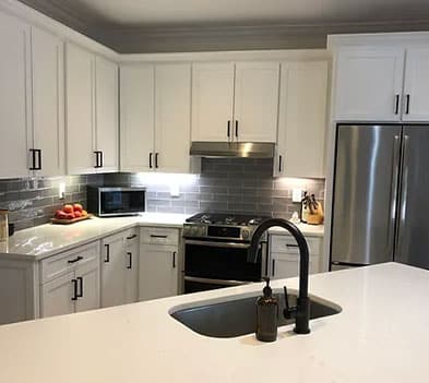 a large kitchen with stainless steel appliances