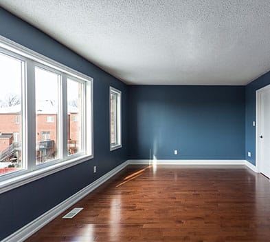 a large empty room with a wooden floor