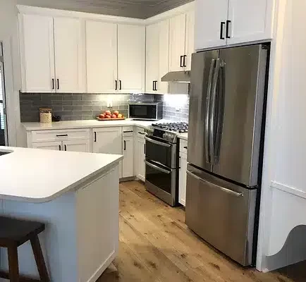 A Large Kitchen With Stainless Steel Appliances