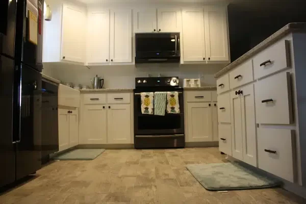 A Large Kitchen With Stainless Steel Appliances