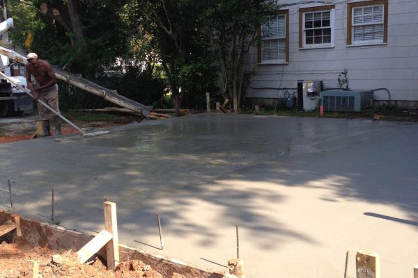 A Body Of Water In Front Of A House