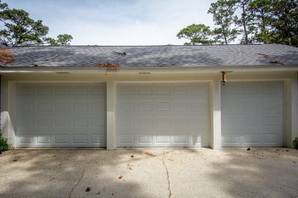 An Empty Parking Lot In Front Of A House