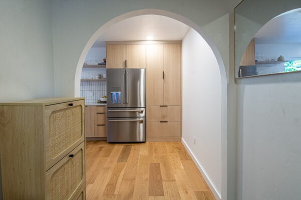 A Kitchen With A Stove And A Refrigerator