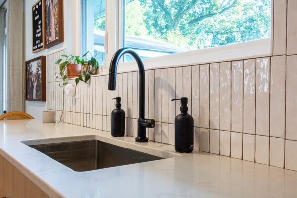 A Kitchen With A Sink And A Window