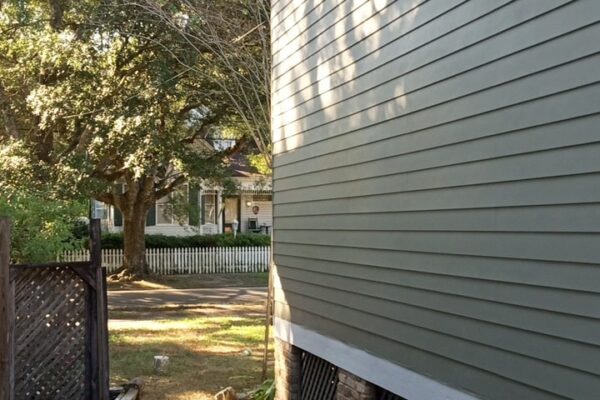 A Chair Sitting In Front Of A House